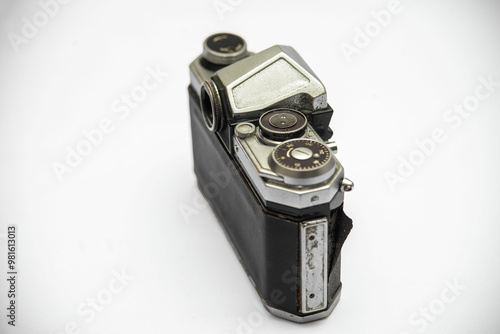 Poorly treated photo camera destroyed by time damaged broken