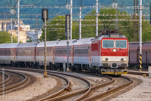A passenger train leaving the railway station.