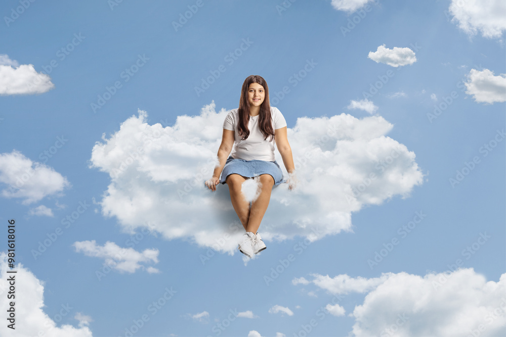 Teenage girl sitting on a cloud Teenage girl sitting on a cloud