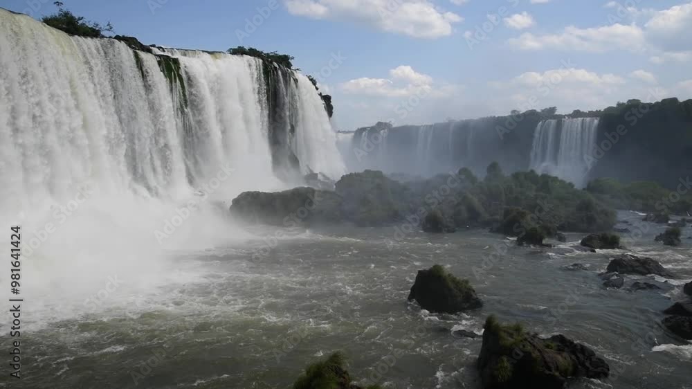 Iguazu Falls is a set of waterfalls located on the Iguazu River between Argentina and Brazil. They are located in the Iguazu National Park. Iguazu Falls is a set of waterfalls located on the Iguazu River between Argentina and Brazil. They are located in the Iguazu National Park.