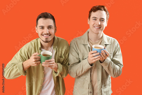 Young men with cups of tea ...