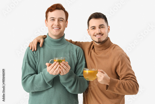Young men with cups of lemo...