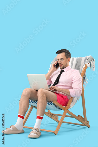 Funny businessman with lapt...