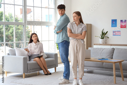 Offended young couple visiting sexologist in office