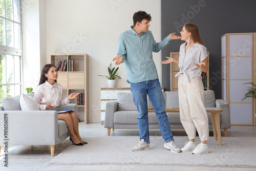 Angry young couple quarreling at sexologist's office