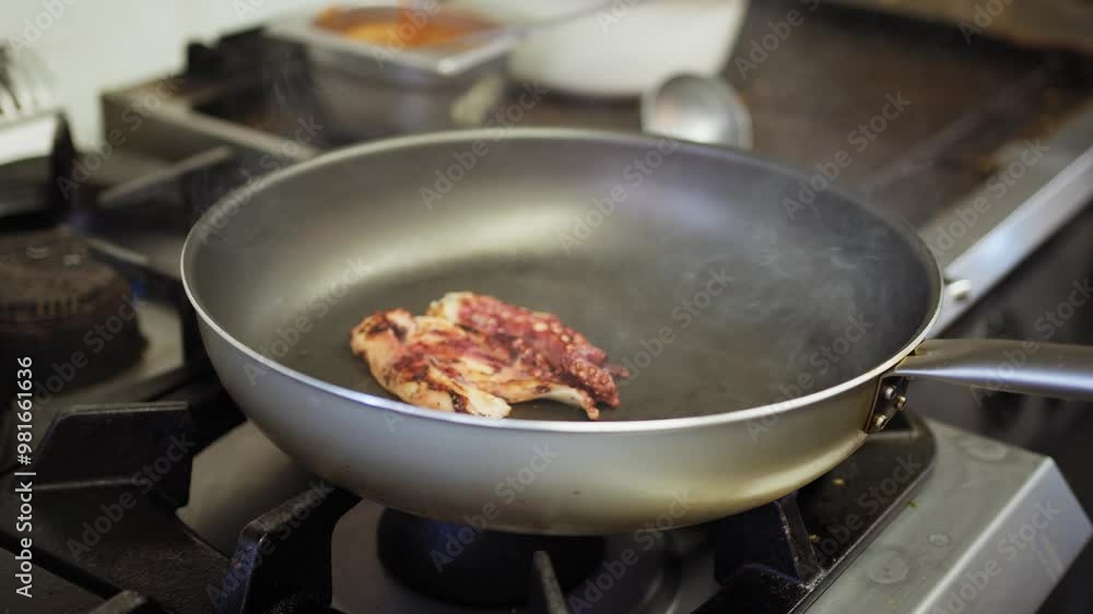 Chef Is Cooking Roasted Octopus In A Pan For Garnishing Main Dish Chef Is Cooking Roasted Octopus In A Pan For Garnishing Main Dish