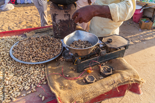 Selling peanuts at an outdoor market. photo