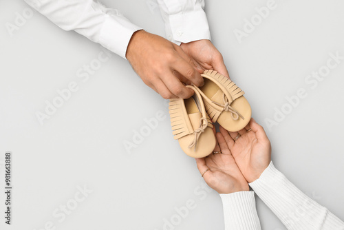 Couple with baby booties on...