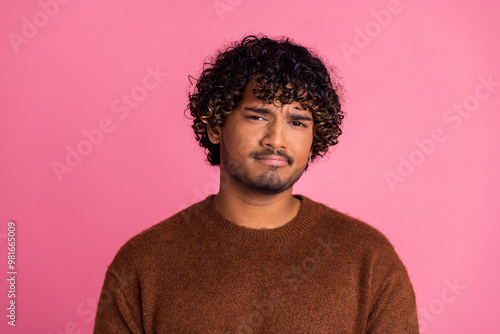 Photo of minded handsome nice man wear trendy brown clothes hmm isolated on pink color background