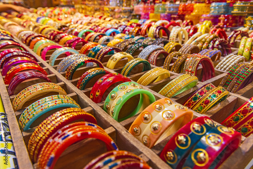 Colorful bangles for sale at an outdoor market.