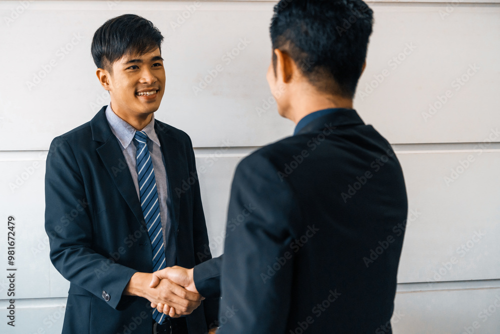 Business people agreement concept. Asian Businessman do handshake with another businessman in the office meeting room. uds Business people agreement concept. Asian Businessman do handshake with another businessman in the office meeting room. uds