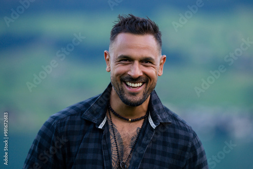 Portrait of the happy handsome man outdoor. A Hipster guy model headshot. Male face. Young handsome man. Confident male model. Hispanic Man looking proud. Closeup face of attractive man. Elegant guy.