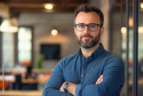 Portrait, glasses and business man with arms crossed in startup office for pride in career or job. Creative, face and confident professional entrepreneur, copywriter and employee coworking , ai