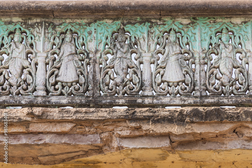 Decorative stone work on a garden wall. photo