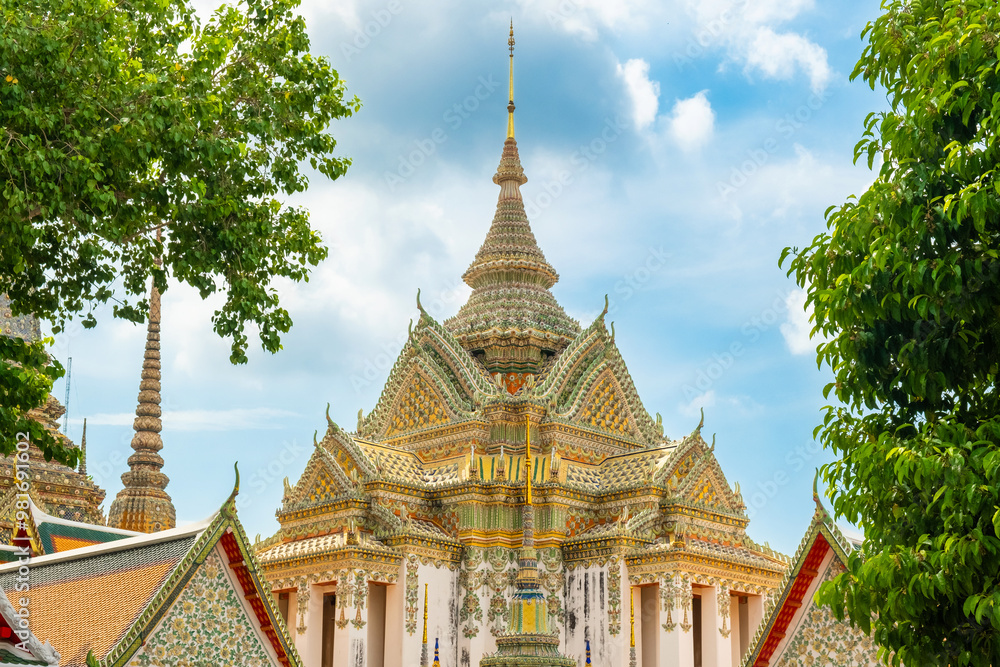 Fototapeta premium Ornate Wat Pho Thai Temple in Bangkok city with traditional Buddhist architecture in Thailand, Asia. Phra Mondop of Temple of the Reclining Buddha. Popular tourist landmark