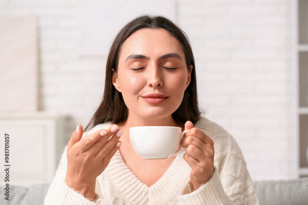 Young woman with cup of coffee at home, closeup Young woman with cup of coffee at home, closeup