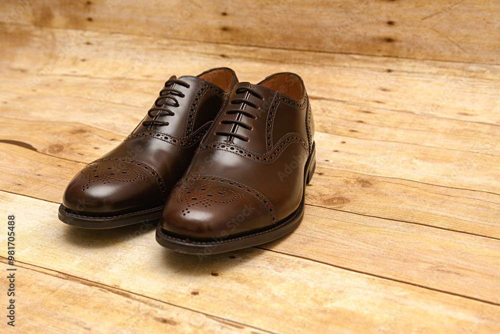 Male fashion shoes on wooden background Male fashion shoes on wooden background