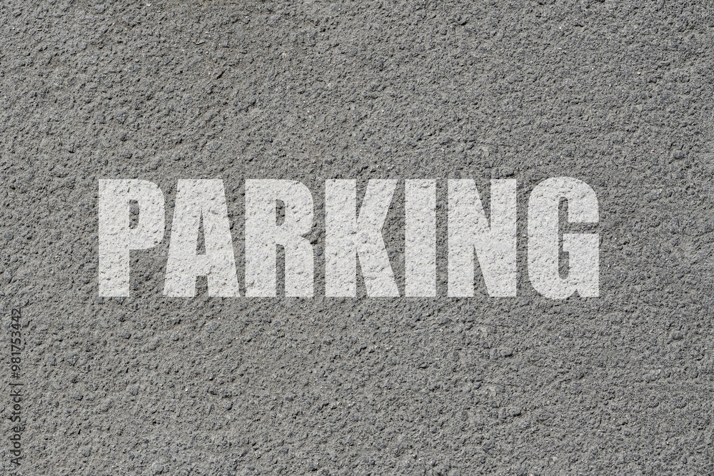 Parking lot. Word Parking written on asphalt, top view Parking lot. Word Parking written on asphalt, top view