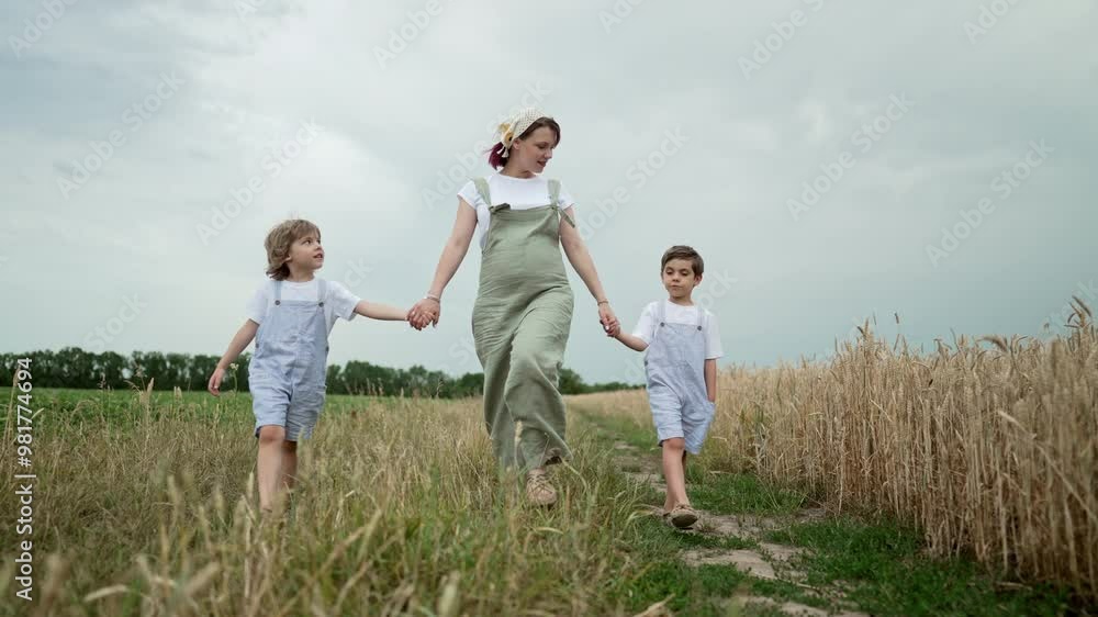 Pregnant Mother Walking with Little Kids On Rural Landscape Path. Ecological Life, Nature Outside City Pregnant Mother Walking with Little Kids On Rural Landscape Path. Ecological Life, Nature Outside City