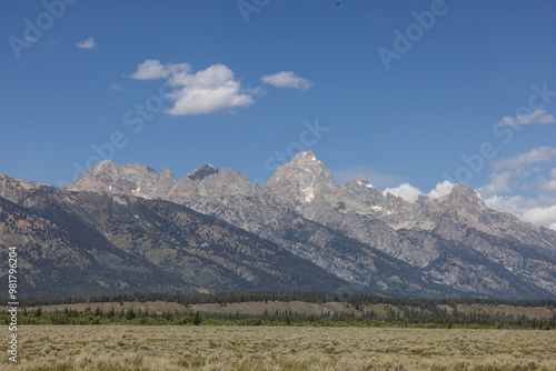 Grand Tetons Mountains on a bright blue sunny day at the Grand Tetons National Park in Wyoming photo