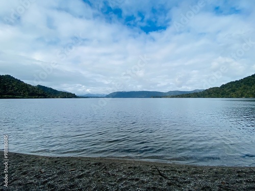 Views of Lake Mapourika , west coast , South Island, New Zealand. Lake and mountains photo