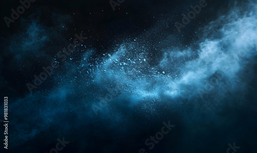 Blue powder explosion on black background.