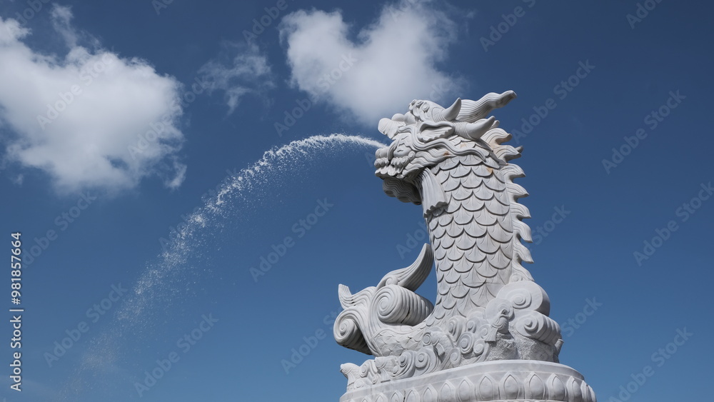 Fototapeta premium Famous Dragon Carp fountain soars into blue sky in Da Nang, Vietnam