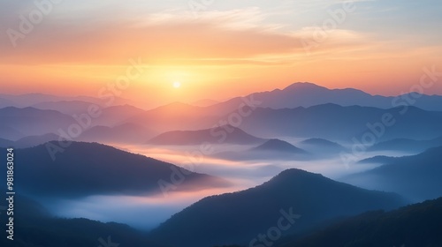 Misty Mountain Sunrise with Rolling Hills and a Golden Sky