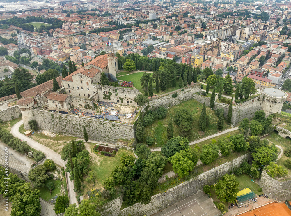 Fototapeta premium Aerial view of Brescia medieval castle, city center, city walls, bastions, vineyards in Lombardy Italy