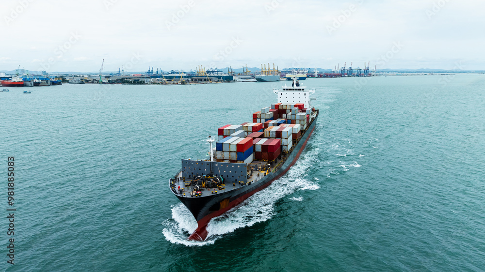 front view Container Ship load container going to seaport or unload at container warehouse on the green sea. Logistics, import export, shipping or transportation Asia Pacific and worldwide. front view Container Ship load container going to seaport or unload at container warehouse on the green sea. Logistics, import export, shipping or transportation Asia Pacific and worldwide.
