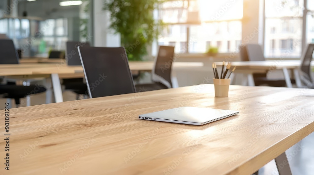 Modern Office Desk with Laptop Pencils and Natural Light Modern Office Desk with Laptop Pencils and Natural Light