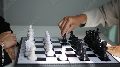 Two business women play a game of chess to be a concept of business competition and problem solving For always good results.