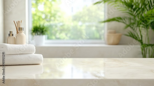 A serene bathroom scene featuring soft towels, skincare products, and natural light for a calming atmosphere. photo