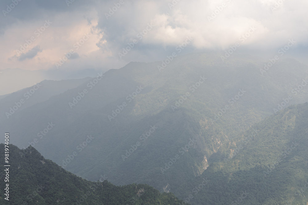 Obraz premium Landscape of foggy mountains in Aba Tibetan and Qiang Autonomous Prefectures. West part of Sichuan province, China