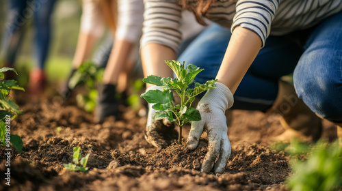 The scene depicts a vibrant community service initiative in a park, where a diverse group of volunteers is engaged in gardening and planting trees. The participants work together, embodying a spirit .