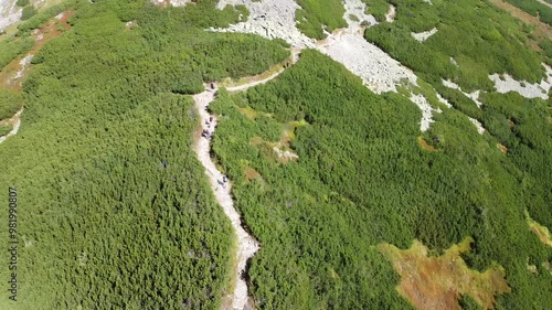 Following tourists climbing Giewont, Tatry ,mountains, Poland, summertime