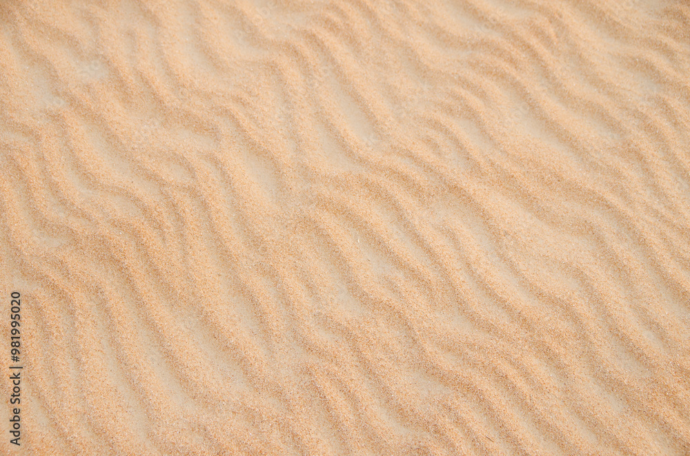 Sand with natural pattern. Beach sand background with natural wave pattern Sand with natural pattern. Beach sand background with natural wave pattern