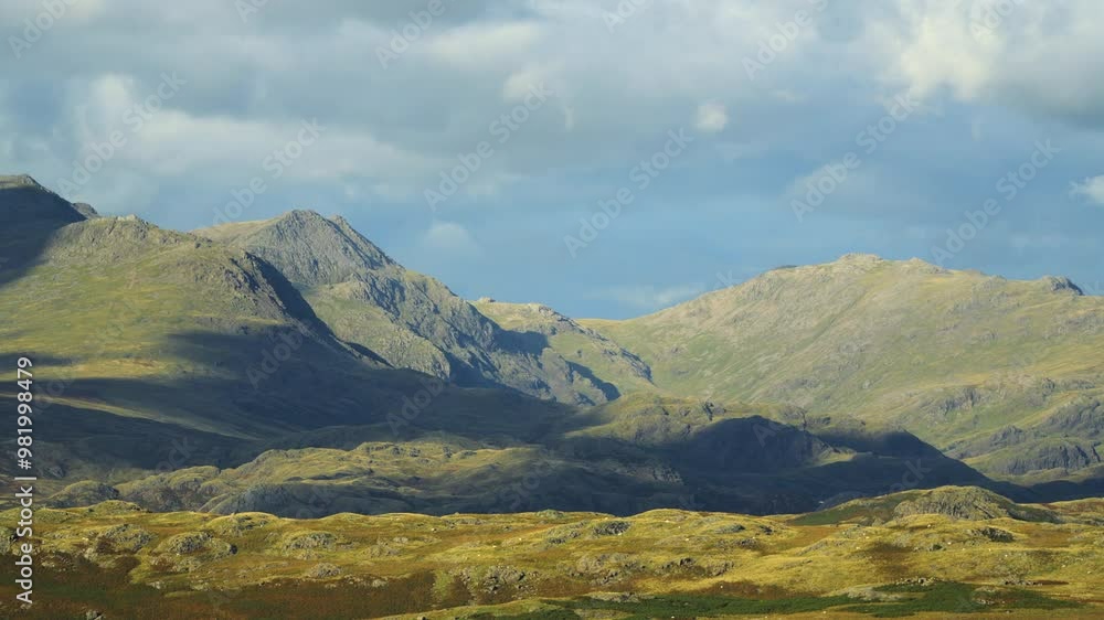 Cloud shadows racing over mountainous and rugged landscape. Time lapse. Cloud shadows racing over mountainous and rugged landscape. Time lapse.