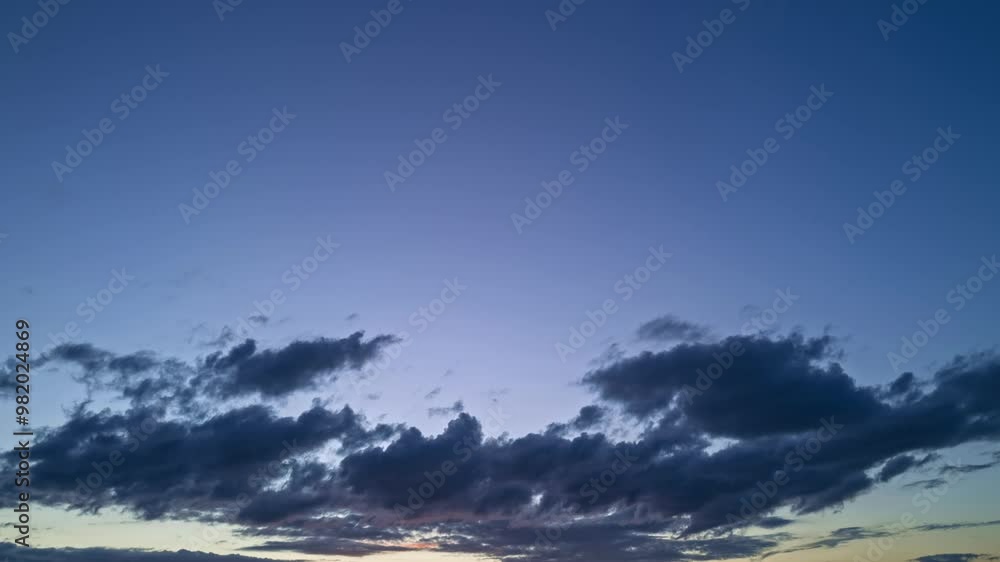 Beautiful sunset sky above clouds with dramatic light. Sunset with sun and clouds on blue and orange dramatic sky with sun rays. Night Sky timelapse. Moving clouds at sunset. Evening Clouds. Beautiful sunset sky above clouds with dramatic light. Sunset with sun and clouds on blue and orange dramatic sky with sun rays. Night Sky timelapse. Moving clouds at sunset. Evening Clouds.