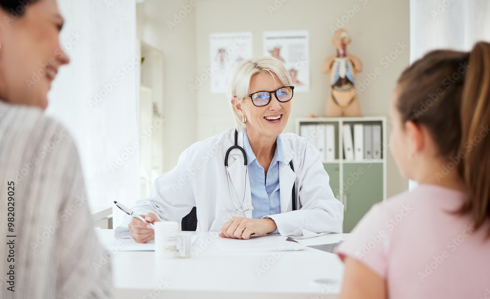 Checkup, doctor and talking to child, smile and mature woman with question, growth and development. Office, mom and daughter in appointment, writing and conversation for health of kid or pediatrician Checkup, doctor and talking to child, smile and mature woman with question, growth and development. Office, mom and daughter in appointment, writing and conversation for health of kid or pediatrician