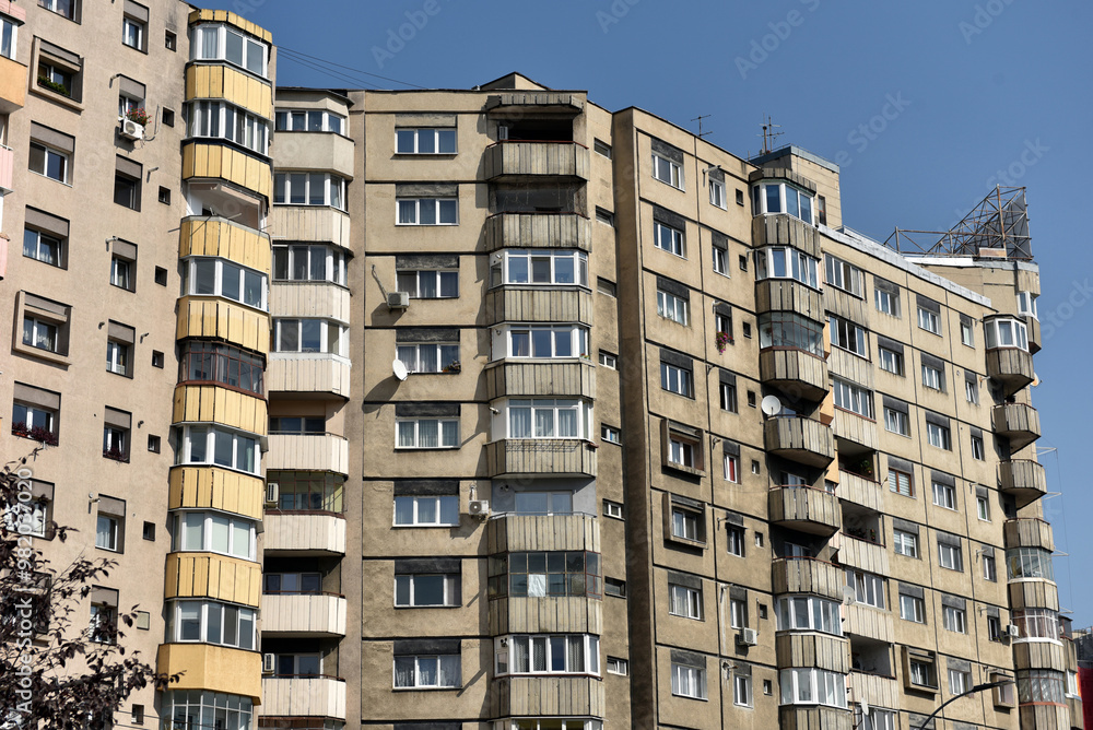 Fototapeta premium Worn out apartment building from the communist era. Traditional communist housing ensemble