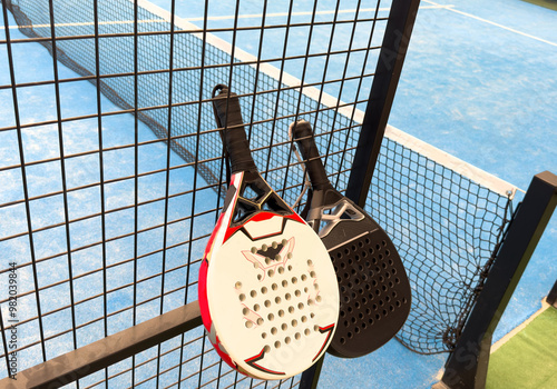  paddle rackets on the playing court photo