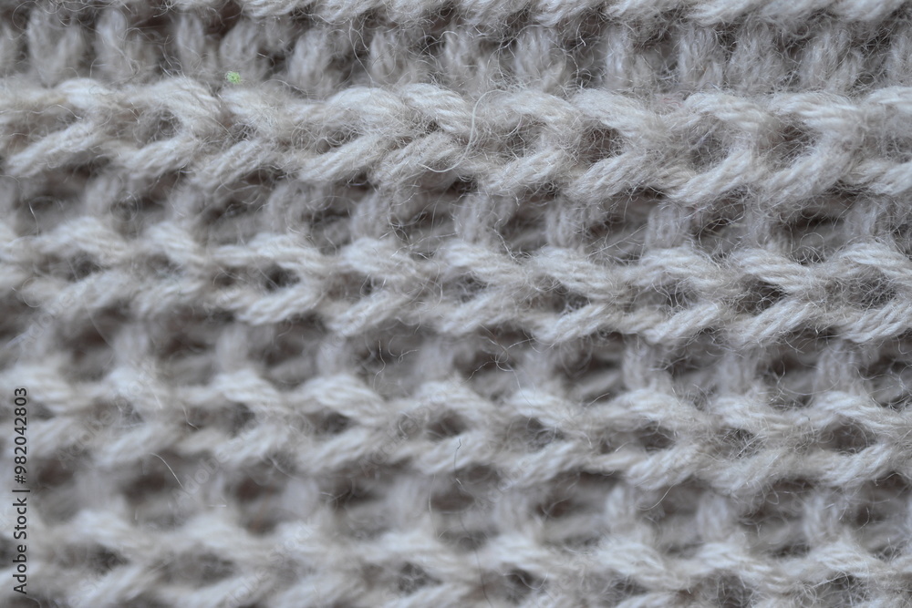 macro texture of woolen pastel crocheted sweater as background, close-up of brown crocheted front surface, woolen texture of woolen wool, trend pastel crocheted front surface macro texture of woolen pastel crocheted sweater as background, close-up of brown crocheted front surface, woolen texture of woolen wool, trend pastel crocheted front surface