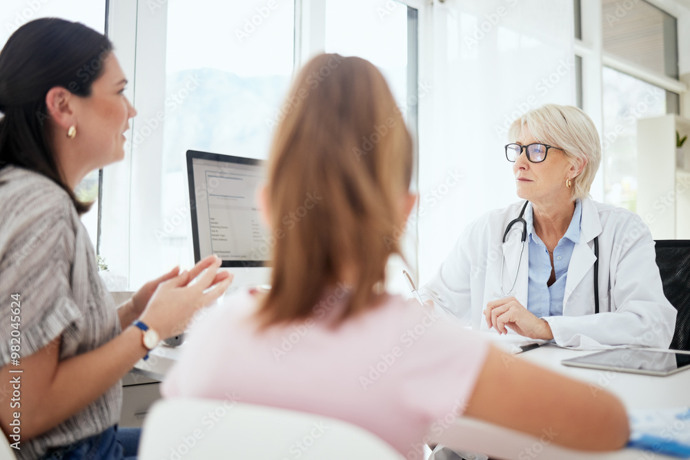 Checkup, doctor and talking to child, question and mature woman with glasses, diagnosis and worry. Office, mom and daughter in appointment, fear and conversation for health of kid and pediatrician Checkup, doctor and talking to child, question and mature woman with glasses, diagnosis and worry. Office, mom and daughter in appointment, fear and conversation for health of kid and pediatrician