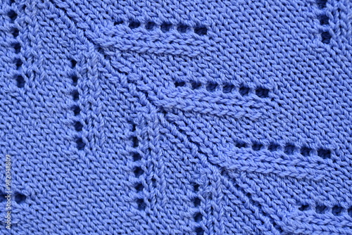 line texture symmetrical pattern, macro texture of cotton purple crochet sweater as background, close up of purple crochet front surface, wool texture of cotton, crochet front surface