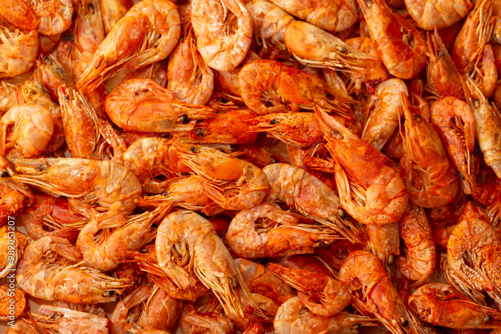 Shrimp close-up in a large pile. Smoked and salted shrimp with spices for a beer snack. Shrimp close-up in a large pile. Smoked and salted shrimp with spices for a beer snack.