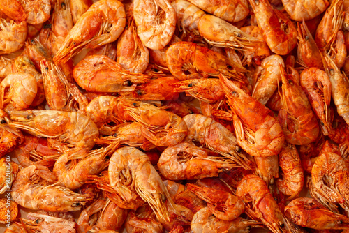 Shrimp close-up in a large pile. Smoked and salted shrimp with spices for a beer snack.