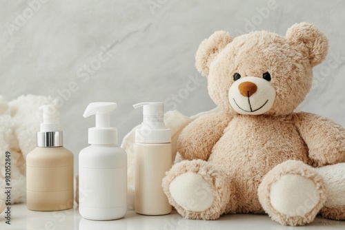 A cuddly teddy bear nestled next to gentle baby skincare products on a soft surface, creating a cozy and nurturing atmosphere photo