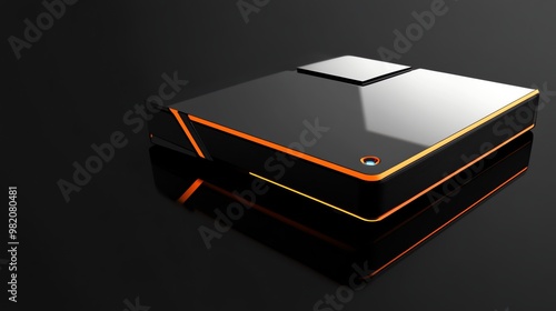 Black and orange gaming console on a black background.