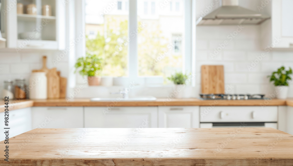 Empty wooden tabletop in front of blurred kitchen furniture Empty wooden tabletop in front of blurred kitchen furniture